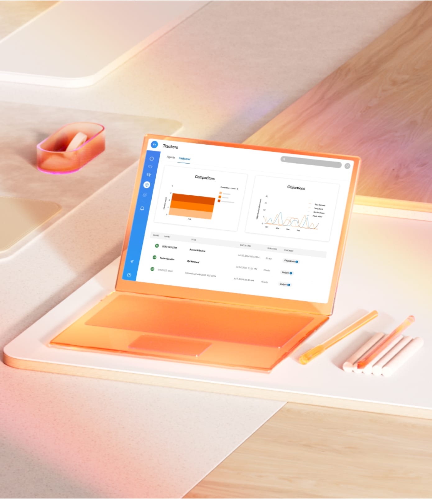A sleek orange laptop on top of a table showing at-a-glance sales views