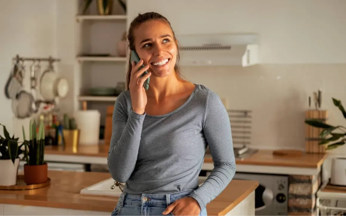 Woman smiling while talking on a mobile phone